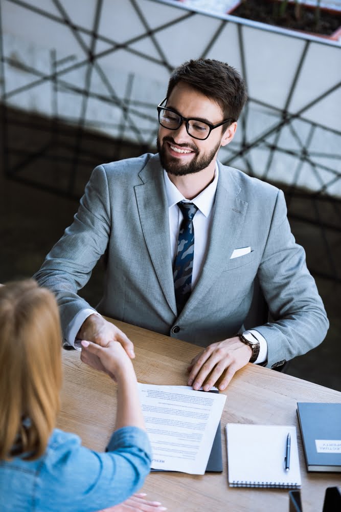 High,angle,view,of,positive,manager,shaking,hand,of,candidate