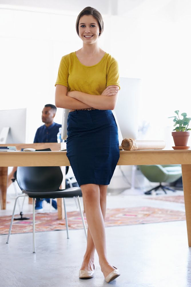 Confident,,woman,or,portrait,in,office,by,computer,,desk,and