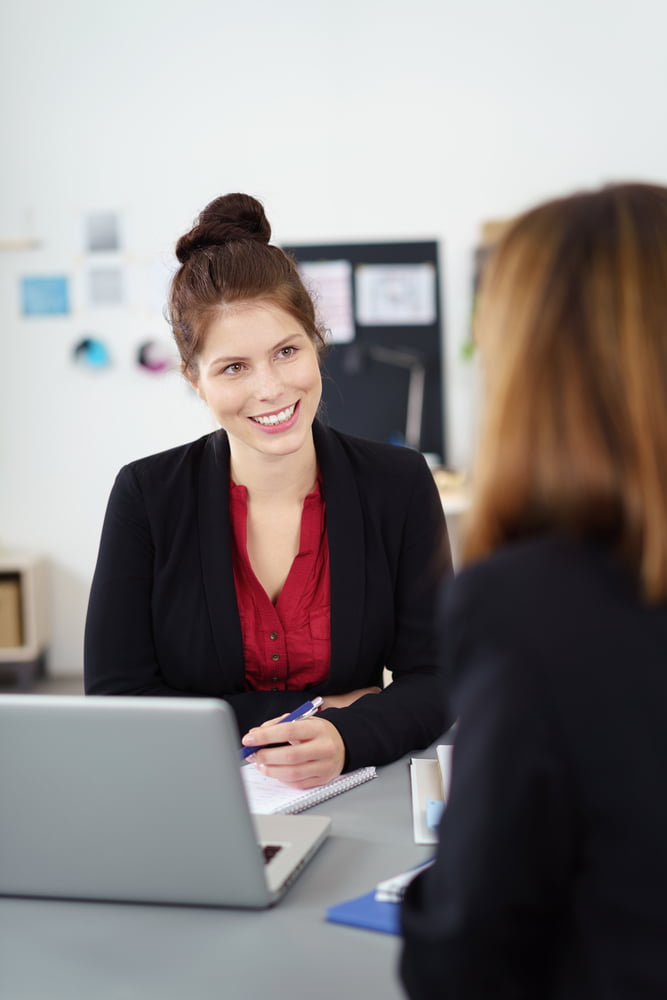 Two,female,business,partners,in,a,meeting,sitting,at,a