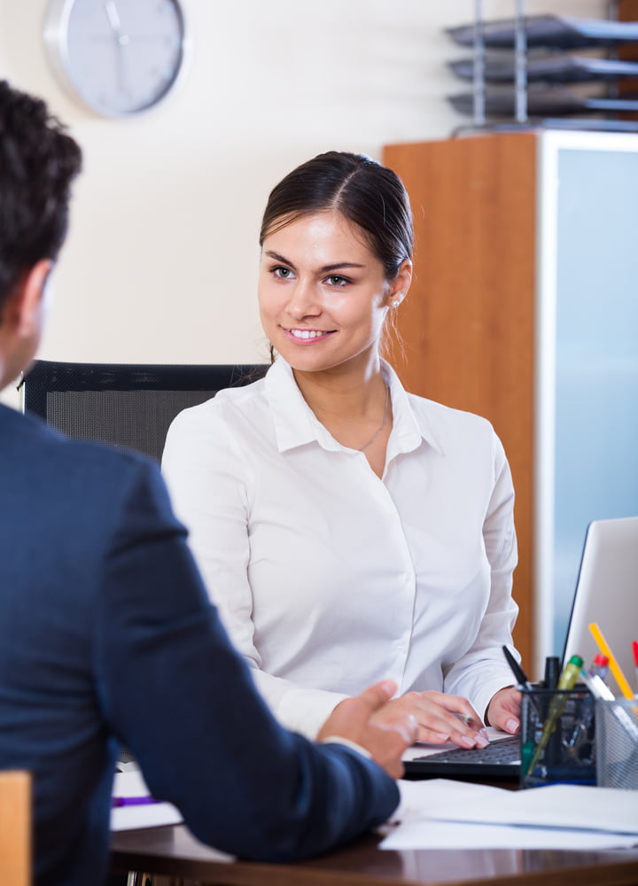 Banking,positive,russian,agent,listening,to,customer,and,smiling,in