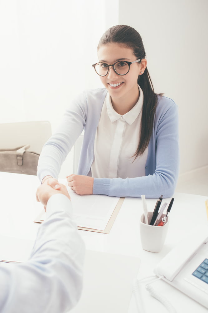 Young,smart,woman,having,a,successful,job,interview,,the,examiner